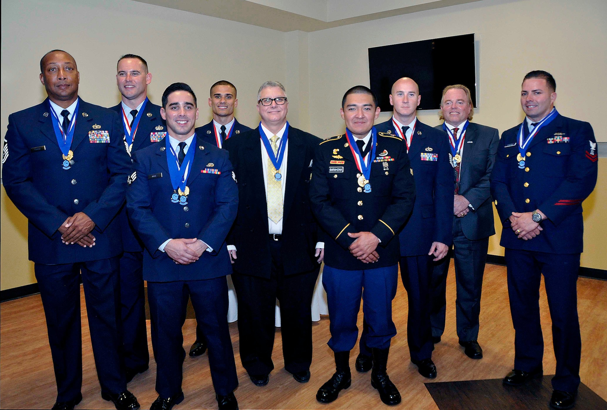 Winners of the 2013 Homestead Air Reserve Base Annual Awards from left, Master Sgt. Phillip Powell,  482nd Force Support Squadron; Senior Master Sgt. Thomas Cougill, 482nd Security Forces Squadron;  Senior Airman Eddy Perez, 482nd Mission Support Group; Staff Sgt. Jose Gonzalez, 482nd Civil Engineering Squadron; Mr. John Bosco, 482nd Communications Squadron; Spc. Giovanni Barahona, Special Operations Command South; Tech. Sgt. Robert Gresham, Det. 1, 125th Fighter Wing, Florida Air National Guard; Mr. Robert Gaddis, Special Operations Command South; and Petty Officer 2nd Class Jesse Gutierrez, U.S. Coast Guard Maritime Safety and Security Team. (U.S. Air Force photo/Senior Airman Aja Heiden)