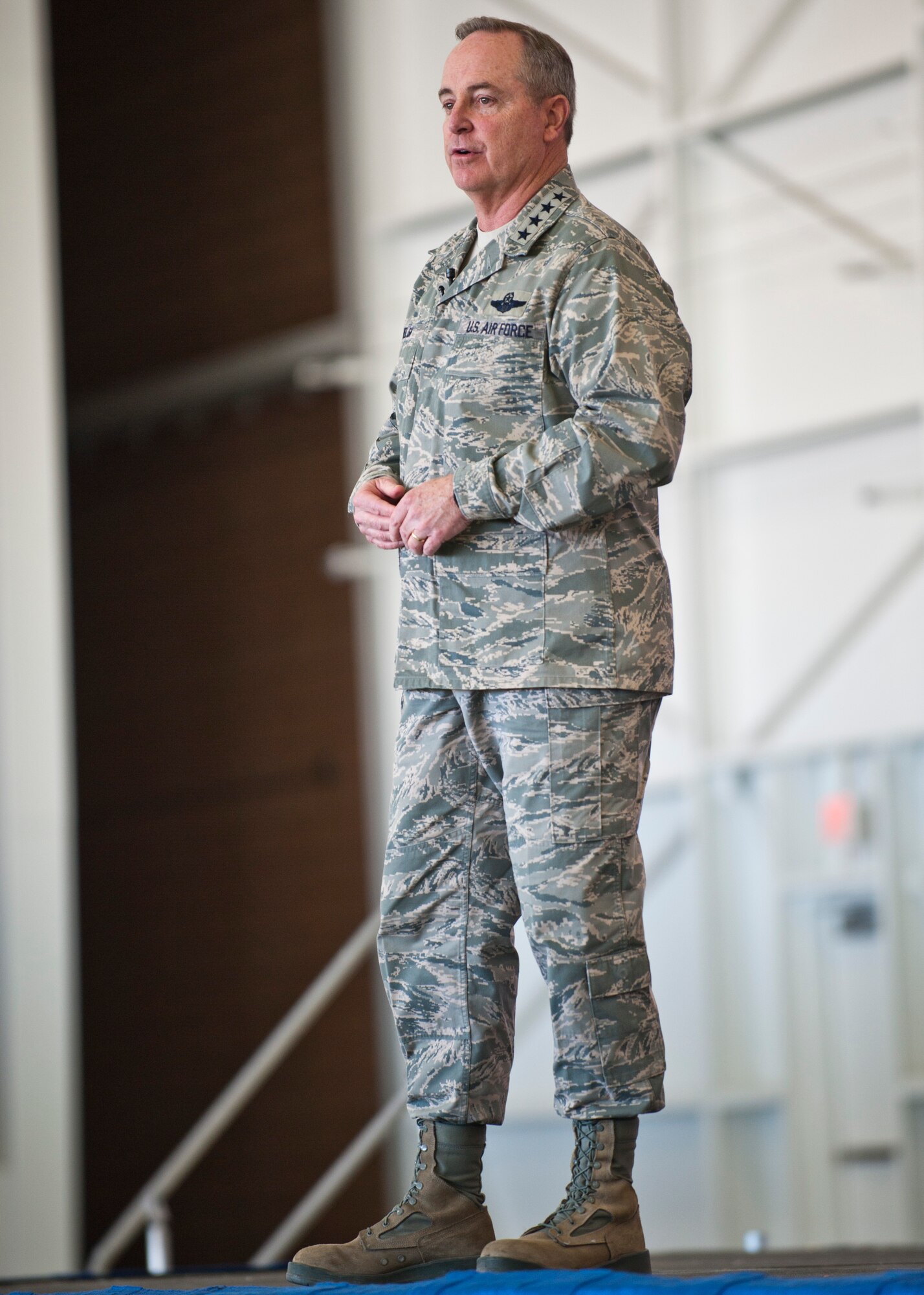 Air Force Chief of Staff Gen. Mark A. Welsh III, speaks to Airmen during a town-hall style meeting, April 7, 2014 at Nellis Air Force Base, Nev.  Welsh, along with Chief Master Sgt. of the Air Force James A. Cody and their spouses, Betty and Athena, visited Nellis to thank Airmen and their families for their many contributions and sacrifices. (U.S. Air Force photo by Senior Airman Jason Couillard)