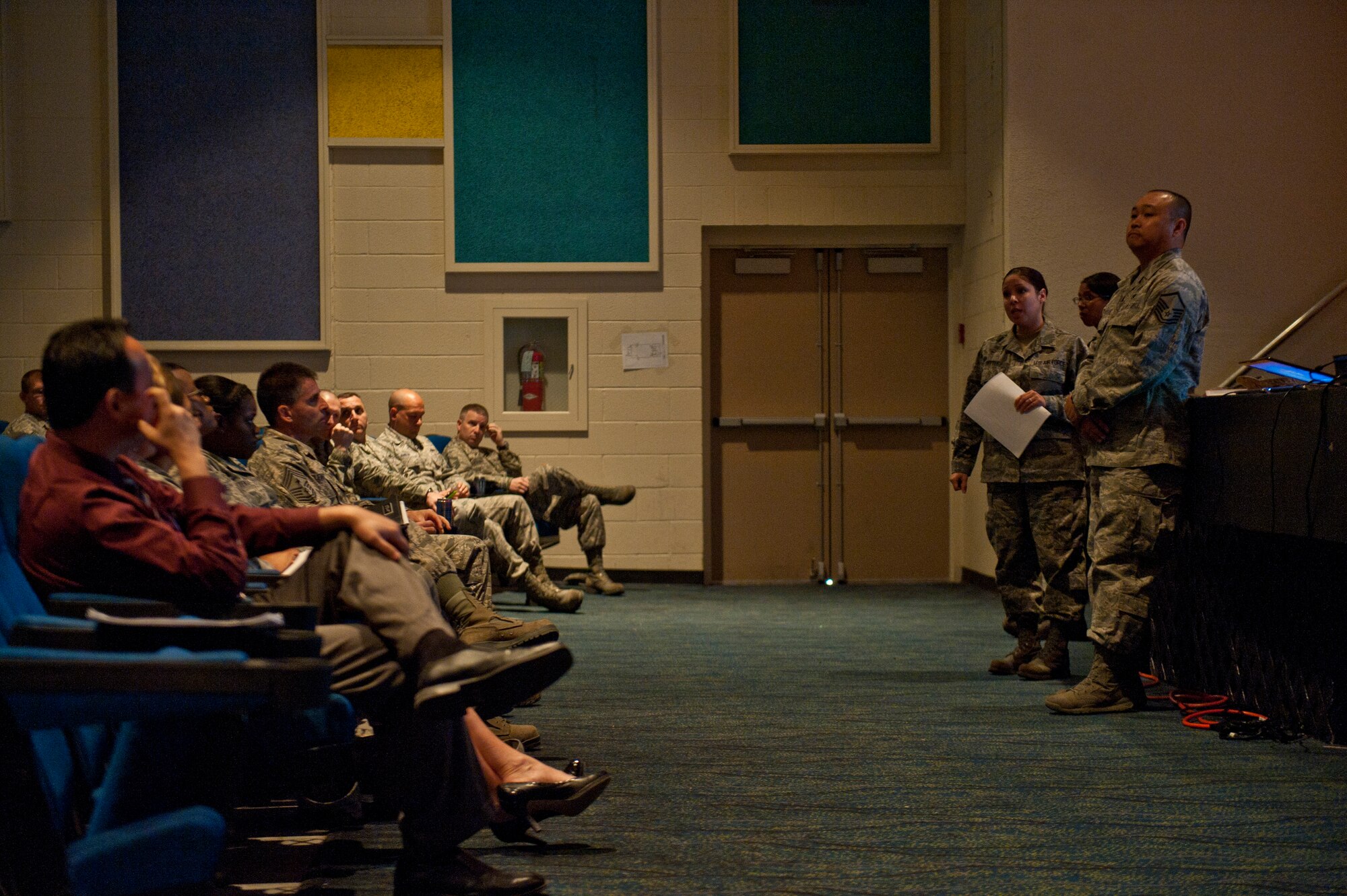 Master Sgt. Rachel Crittle, 99th Force Support Squadron military personnel section superintendent, answers questions during a force management town hall meeting April 3, 2014 at Nellis Air Force Base, Nev. Representatives from multiple organizations on base were present to answer questions regarding the effects force management  will have on their organizations. (U.S. Air Force photo by Airman 1st Class Timothy Young)