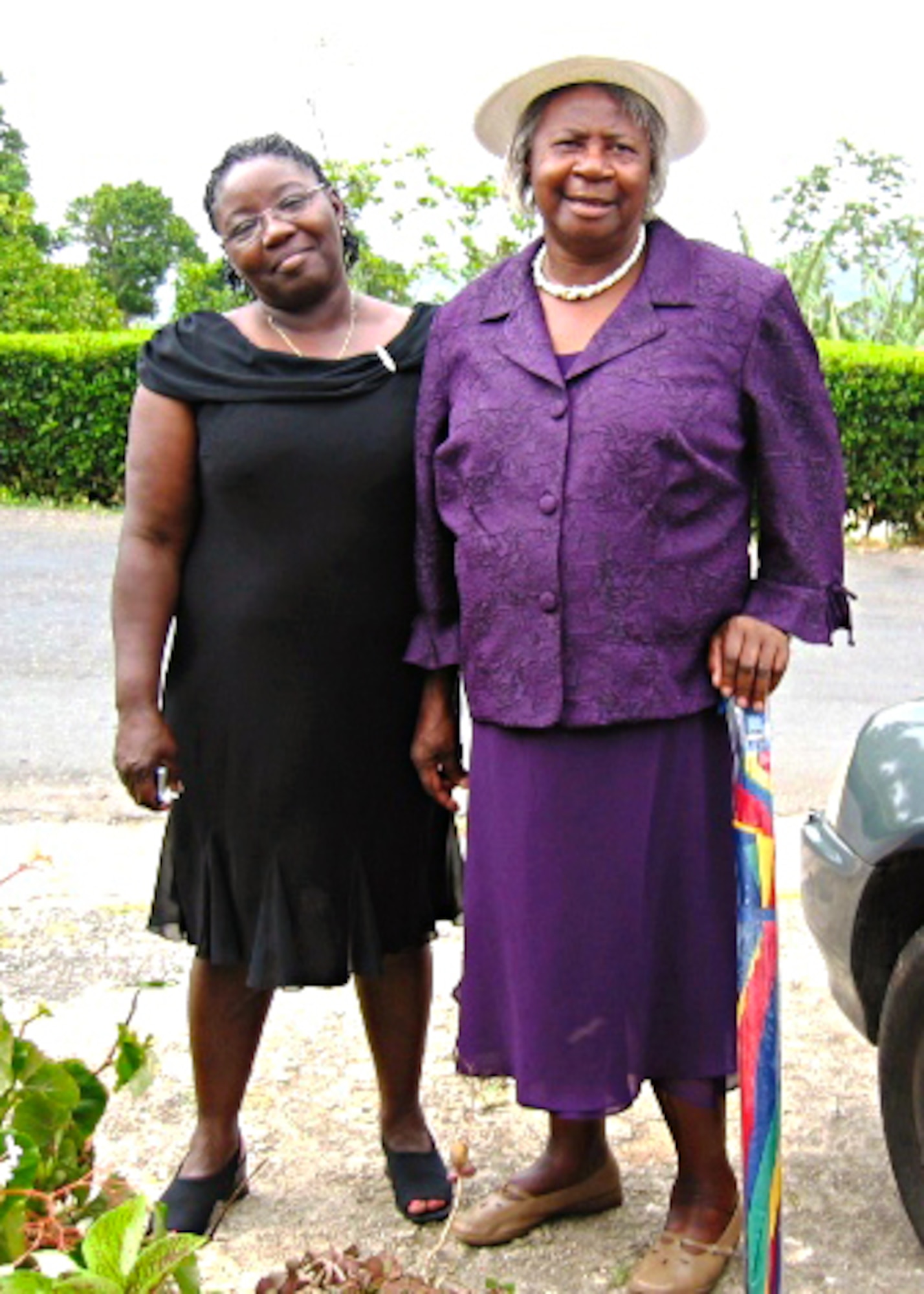 Eugenia Neil and Hilda Blake, relatives of U.S. Air Force Master Sgt. Kenry Peart, 633rd Communications Squadron knowledge operations section chief, stand outside Blake’s home located in the Parish of Manchester, Jamaica in this undated photo. As a child, Blake, Peart’s great aunt, had a large impact on not only his life, but his entire family. She raised Peart’s mother, and always encouraged her to fulfill her dreams. (Courtesy photo)