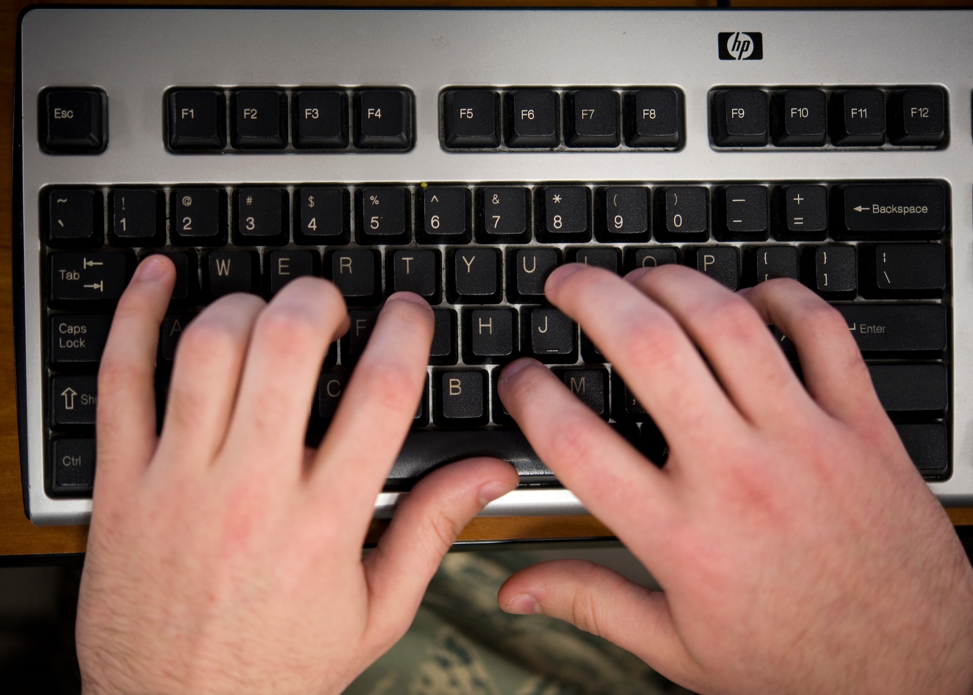 Senior Airman Ryan Lee, 436th Communications Squadron knowledge operations manager, types on his keyboard April 3, 2014, at Dover Air Force Base, Del. Lee’s Appointment Letter Management Tool is expected to be implemented Air Force-wide. (U.S. Air Force photo/Airman 1st Class Zachary Cacicia) 