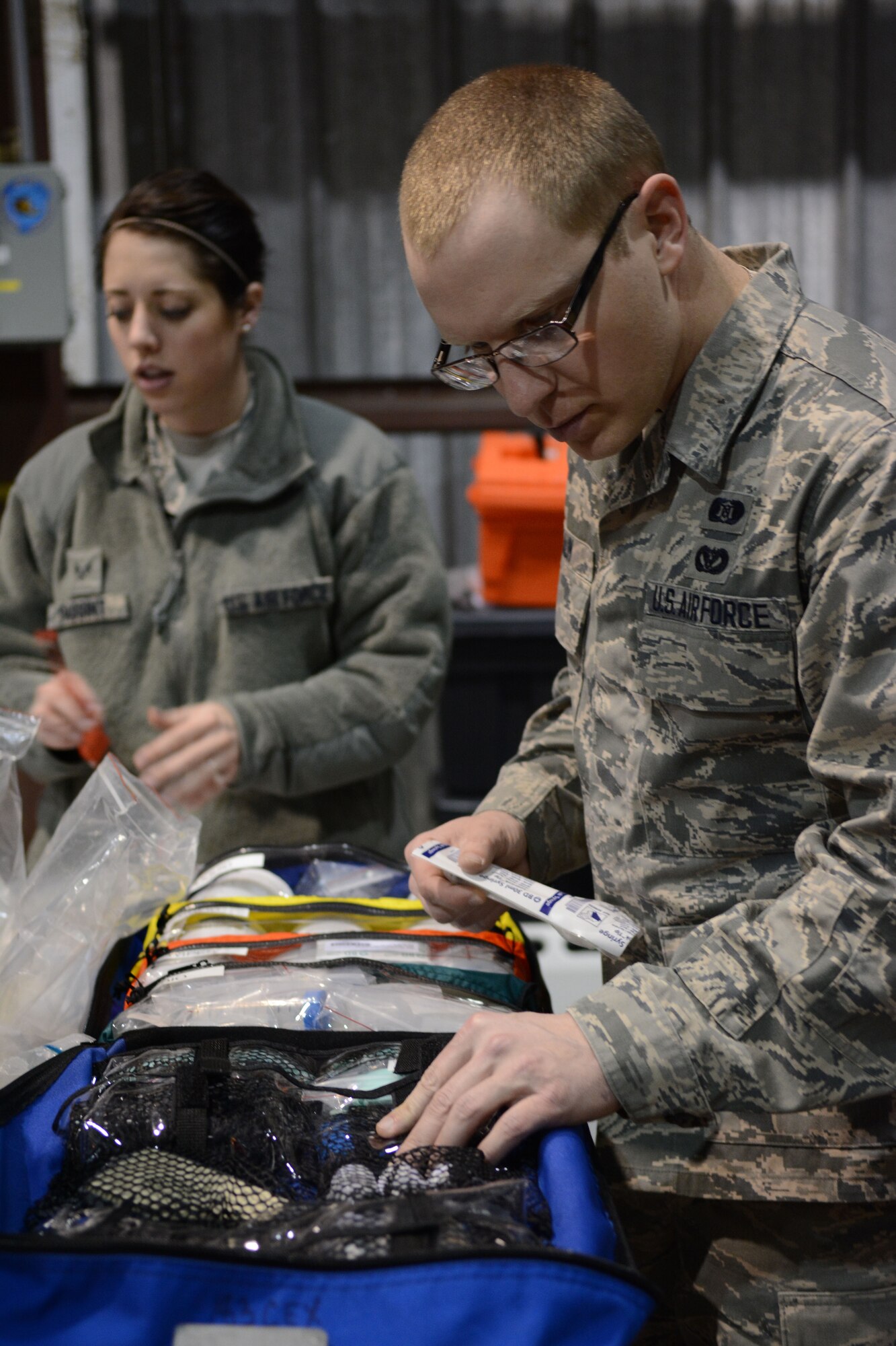 Senior Airman Jason Braun, 934th emergency management, checks equipment prior to a field exercise at Volk Field Air National Guard Base, Wis., April 4, 2014. Twenty-eight Airmen teamed up from six units for training that encompassed all hazard responses including radiation, chemical and biological situations. The training was part of emergency management’s annual training requirement. (Air National Guard photo by Senior Airman Andrea F. Liechti)