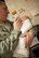 U.S. Air Force Tech. Sgt. Dustin Mize, NCO in charge of ambulance services from the 5th Medical Group, holds his nine-week-old daughter, Ashlyn, during a Dad’s 101 class on Minot Air Force Base, N.D., April 1, 2014. After teaching the swaddling technique, Mize demonstrated how to soothe and feed a newborn baby. (U.S. Air Force photo/ Airman 1st Class Sahara L. Fales)