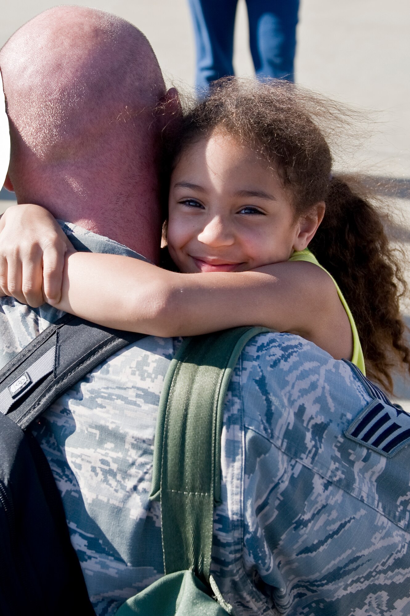 Staff Sgt. Robert Denby, 4th Equipment Maintenance Squadron munitions technician, hugs his niece, April 5, 2014, at Seymour Johnson Air Force Base, N.C.  Denby, along with nearly 300 other Airmen, were deployed to the 380th Air Expeditionary Wing in Southwest Asia to enhance regional partnerships, support security exercises, and demonstrate a continued commitment to area security and stability.  (U.S. Air Force photo/Airman 1st Class Brittain Crolley)