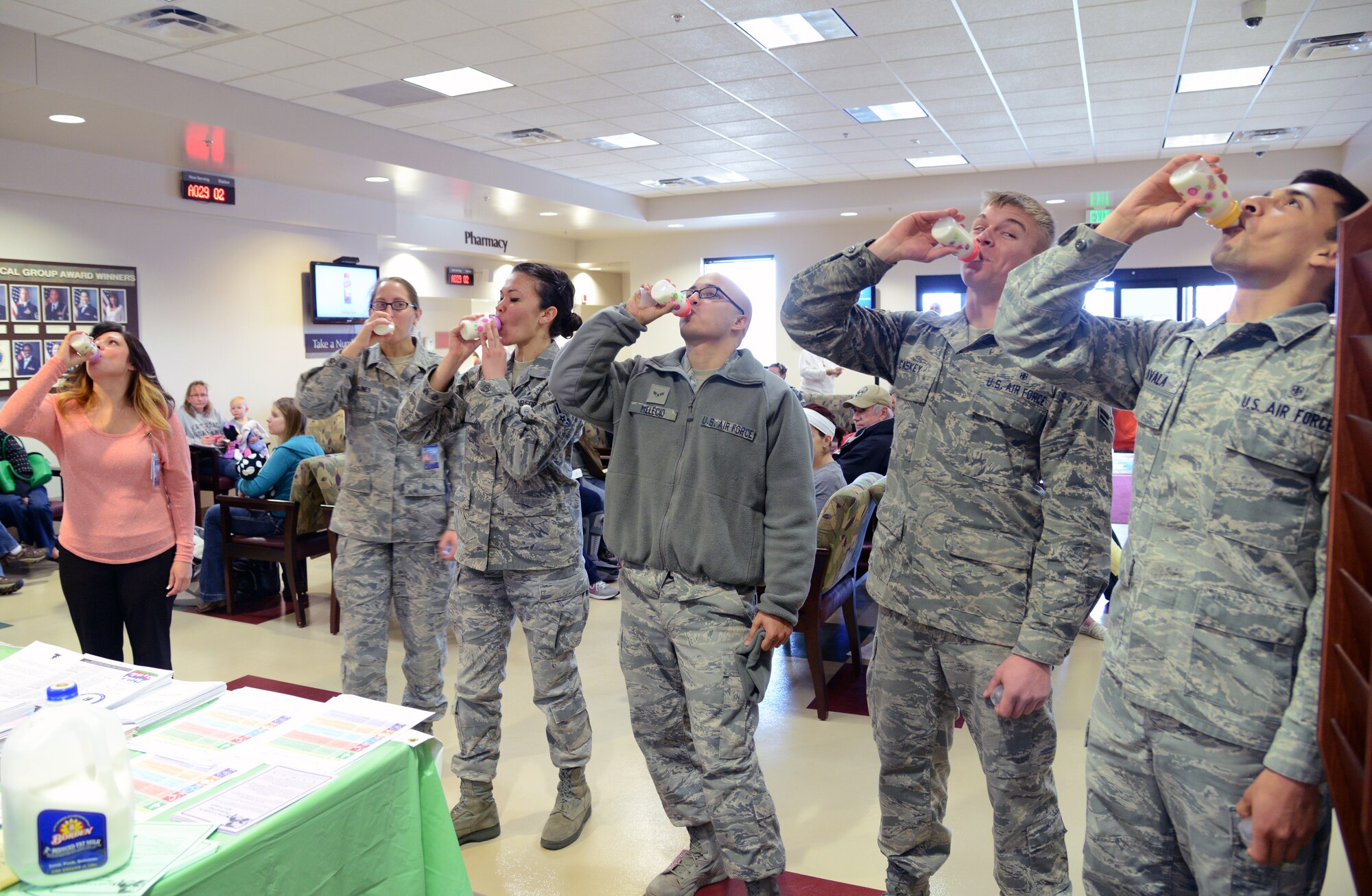 PETERSON AIR FORCE BASE, Colo. – Several volunteers participate in a milk-drinking contest for Public Health Week at the Peterson Clinic April 7. The contest was one of several events designed to raise awareness of public health. (U.S. Air Force photo/Tech. Sgt. Jared Marquis)