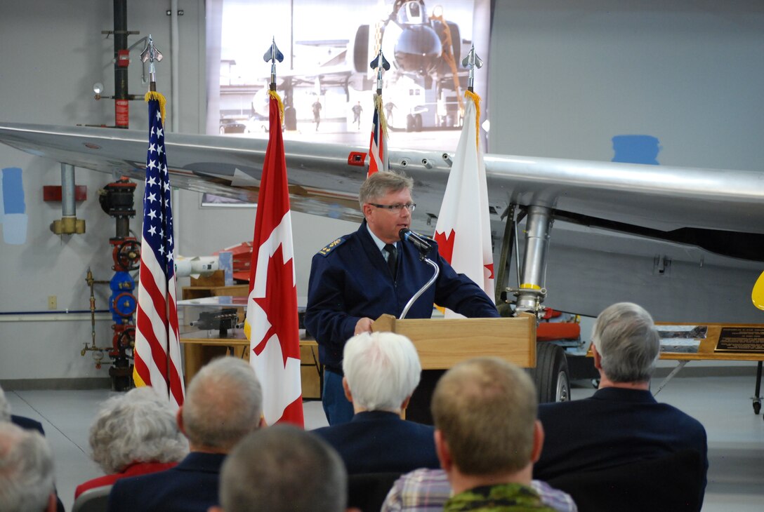 PETERSON AIR FORCE BASE, Colo. – Lt. Gen. Alain Parent, North American Aerospace Defense Command deputy commander, speaks to an audience of fellow Canadians and service members during a ceremony to celebrate the Royal Canadian Air Force’s 90th birthday April 1. The ceremony, held at the Peterson Air and Space Museum hangar, marked the day the Canadian Air Force was officially established and the prefix "Royal" was adopted. Canada is a part of NORAD, a bi-national military organization that monitors and defends North American airspace. The unique partnership formed more than 50 years ago continues to play a vital role in ensuring the mutual security of Canada and the United States. (U.S. Air Force photo/Michael Golembesky)