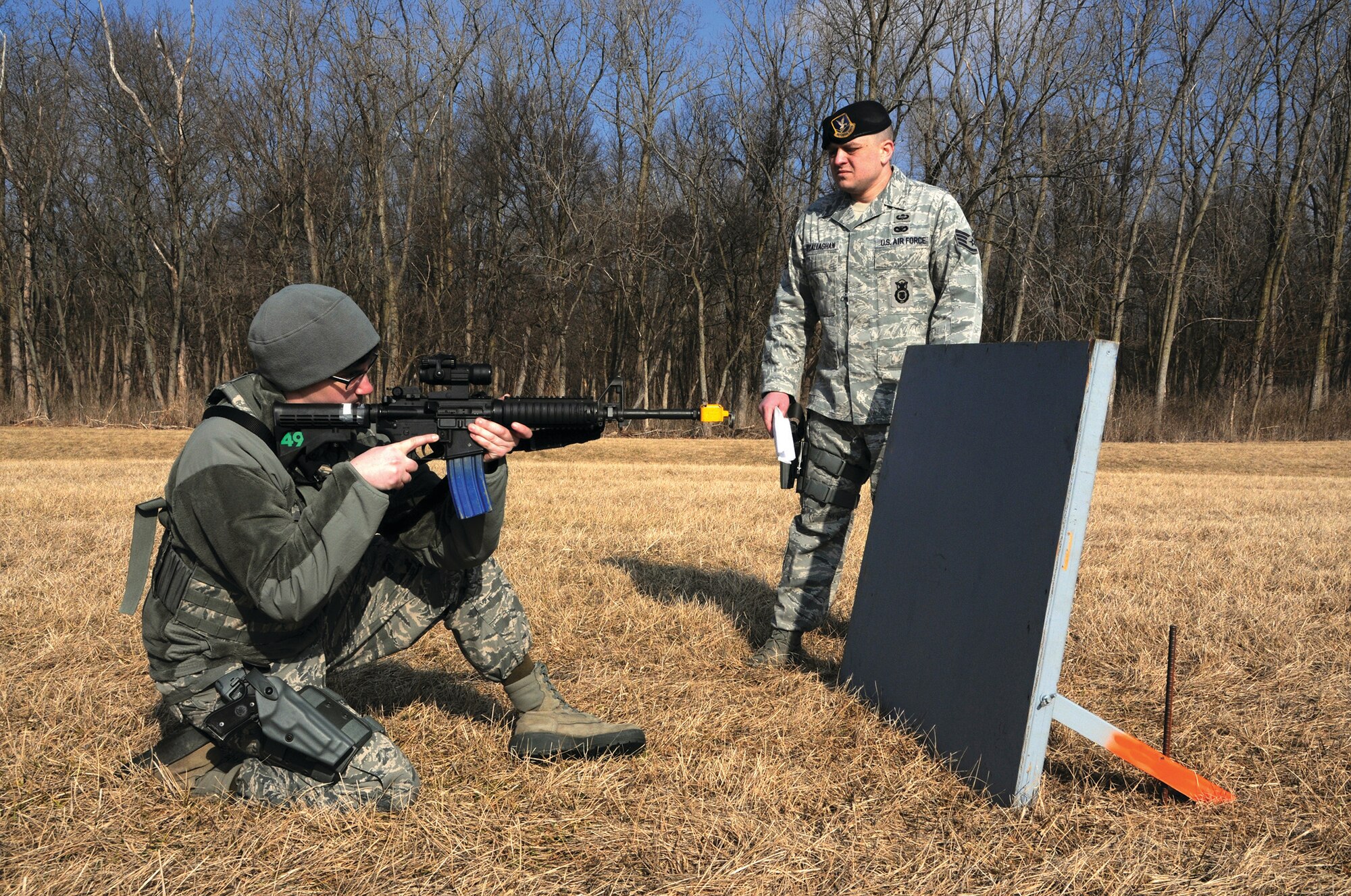WRIGHT-PATTERSON AIR FORCE BASE, Ohio - Airman 1st Class Katie Wheeler, 445th Security Forces Squadron, practices maneuvering techniques as Staff Sgt. Michael O’Callaghan, 445 SFS course instructor, looks on during the unit’s “shoot, move, communicate” training event March 9. (U.S. Air Force photo/Tech. Sgt. Anthony Springer)