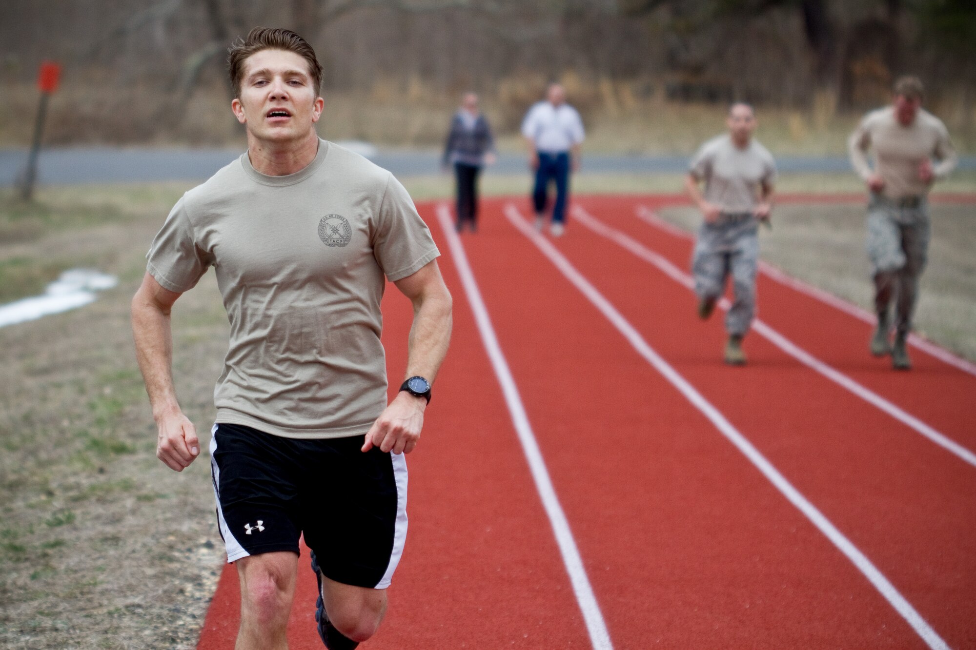A picture of U.S. Air Force Airman 1st Class Daniel Weiler running on the 177th Fighter Wing track