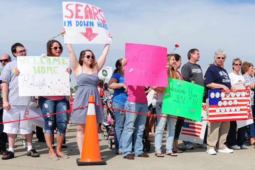 Members of Team Seymour wait as Airmen returning from a deployment arrive, April 5, 2014, at Seymour Johnson Air Force Base, N.C. More than 200 supporters came out to welcome the returnees home. (U.S. Air Force photo/Senior Airman John Nieves Camacho) 

