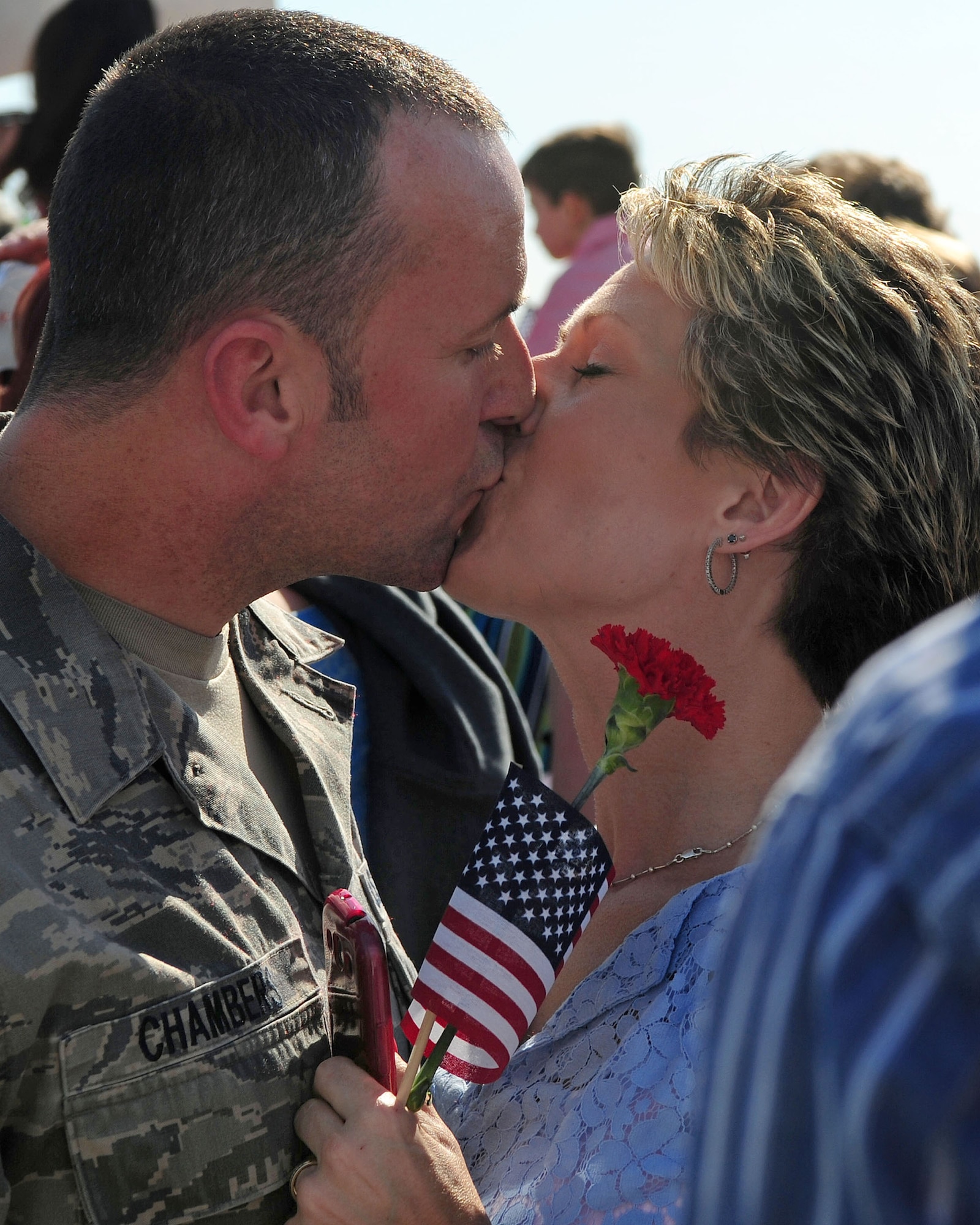 Master Sgt. Jeremy Chambers, 4th Aircraft Maintenance Squadron productions superintendent, shares an intimate moment with a loved one as he returns from a deployment, April 5, 2014, at Seymour Johnson Air Force Base, N.C. While deployed to the 380th Air Expeditionary Wing in Southwest Asia, Airmen enhanced regional partnerships and supported security exercises. (U.S. Air Force photo by Senior Airman John Nieves Camacho)