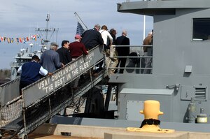 Members of the Williamsburg Area Chamber and Tourism Alliance Community Leadership Service program board the U.S. Army Vessel Chickahominy during an installation tour at Fort Eustis, Va., April 1, 2014. The CLS program gives participants a unique perspective of the Greater Williamsburg area including its governing bodies, key institutions and military organizations. (U.S. Air Force photo by Senior Airman Teresa J.C. Aber/Released)