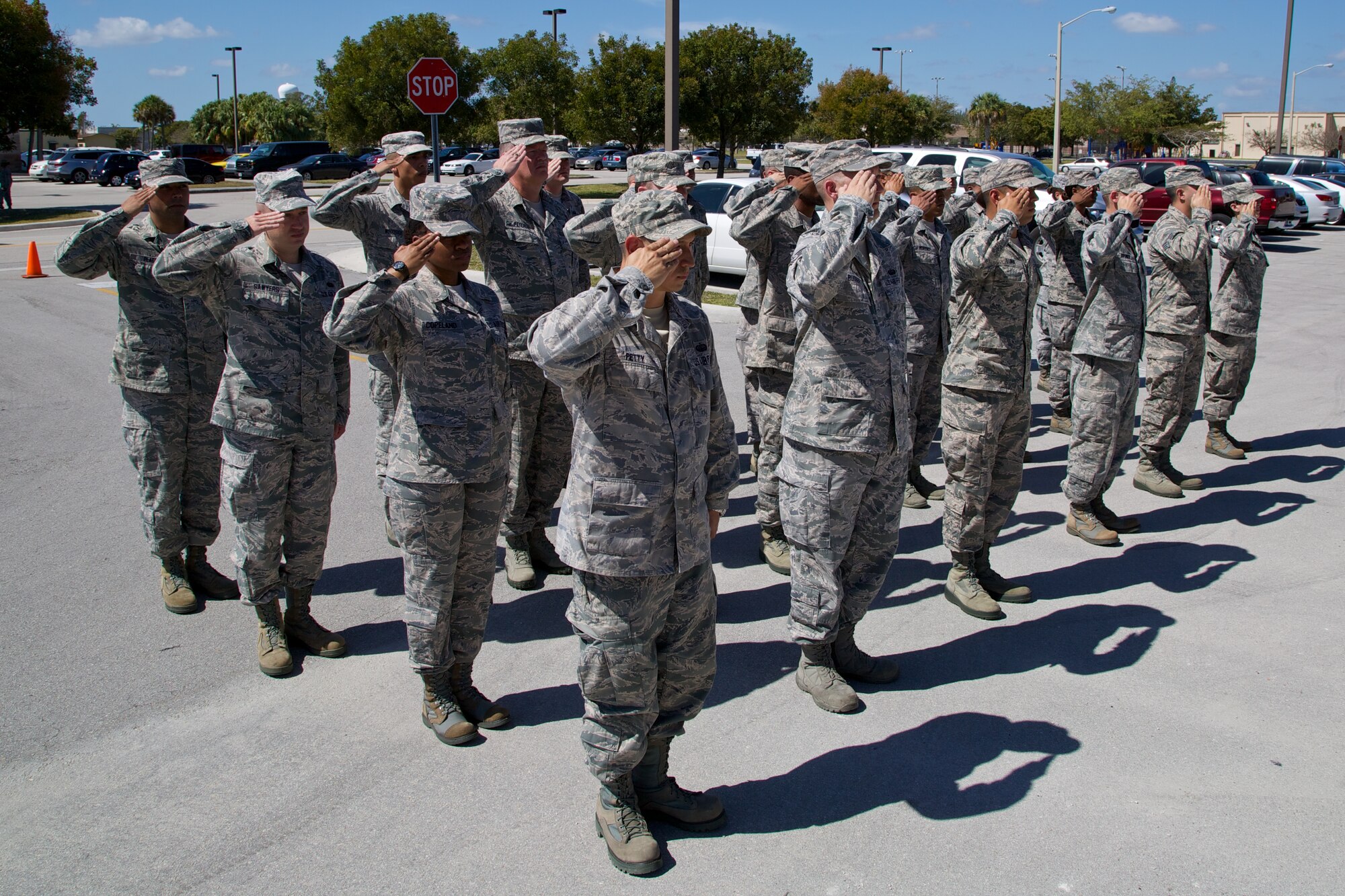 Members of the 482nd Communication Squadron salute their new commander, Maj. Michael D. Wells for the first time during and Assumption of Command Ceremony April 5 at Homestead Air Reserve Base, Fla. Wells assumes command of the 482nd CS after serving as chief of inspection plans for Air Force Reserve Command Headquarters at Robins Air Force Base, Ga. (U.S. Air Force photo by/Tech. Sgt. Lionel Castellano)