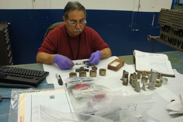 An Air Force technician performs a detailed inspection on several component parts integral to overhauling a constant speed drive. The combined team of DLA, Air Force, and end-item customers has enhanced processes improving CSD availability. (Courtesy photo)