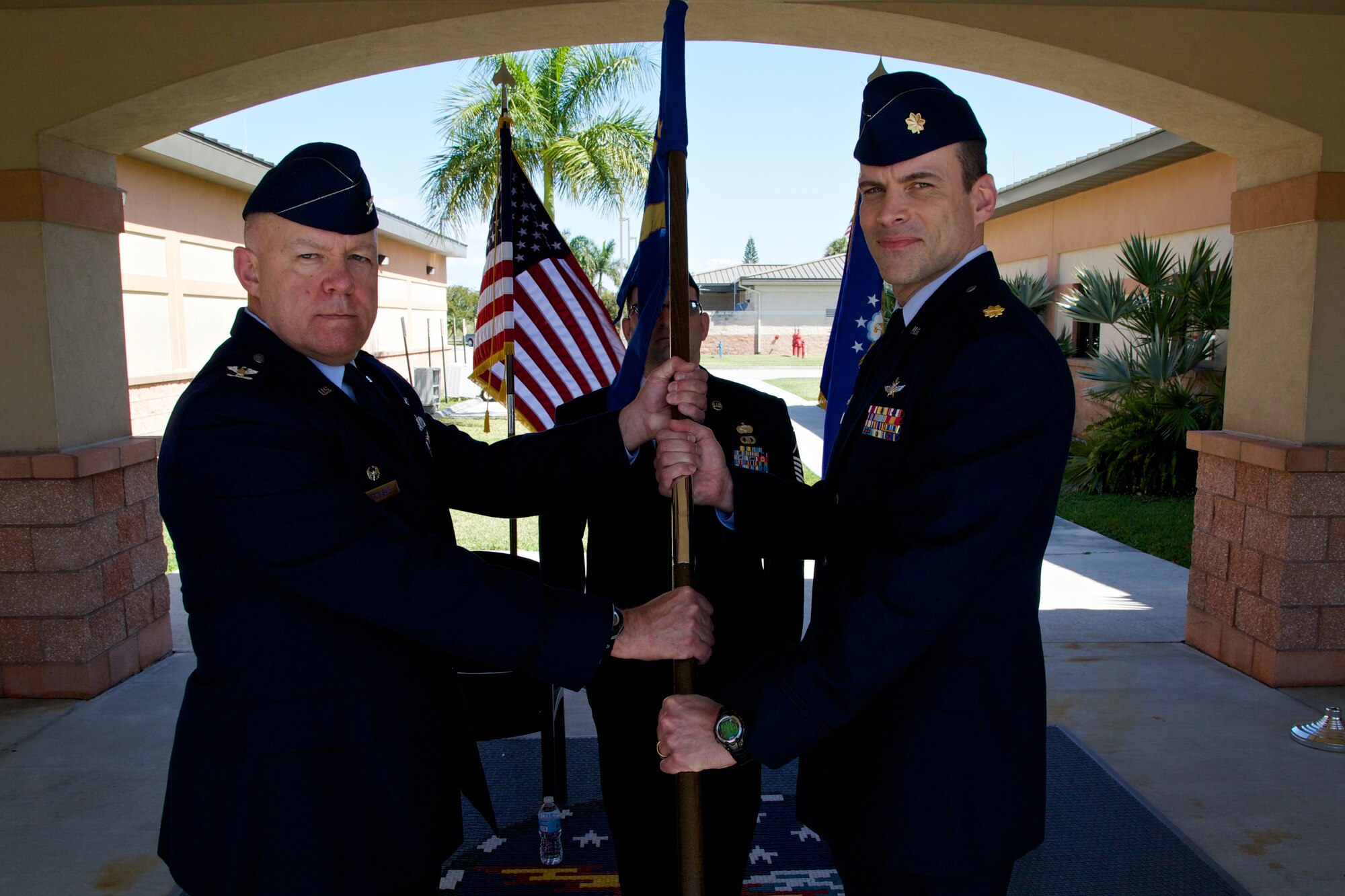 Col. Elwin R. Rozyskie, commander of the 482nd Mission Support Group, passes the guidon to Maj. Michael D. Wells, commander of the 482nd Communication Squadron, during an Assumption of Command Ceremony April 5 at Homestead Air Reserve Base, Fla. Wells assumes command of the 482nd CS after serving as chief of inspection plans for Air Force Reserve Command Headquarters at Robins Air Force Base, Ga. (U.S. Air Force photo by/Tech. Sgt. Lionel Castellano)