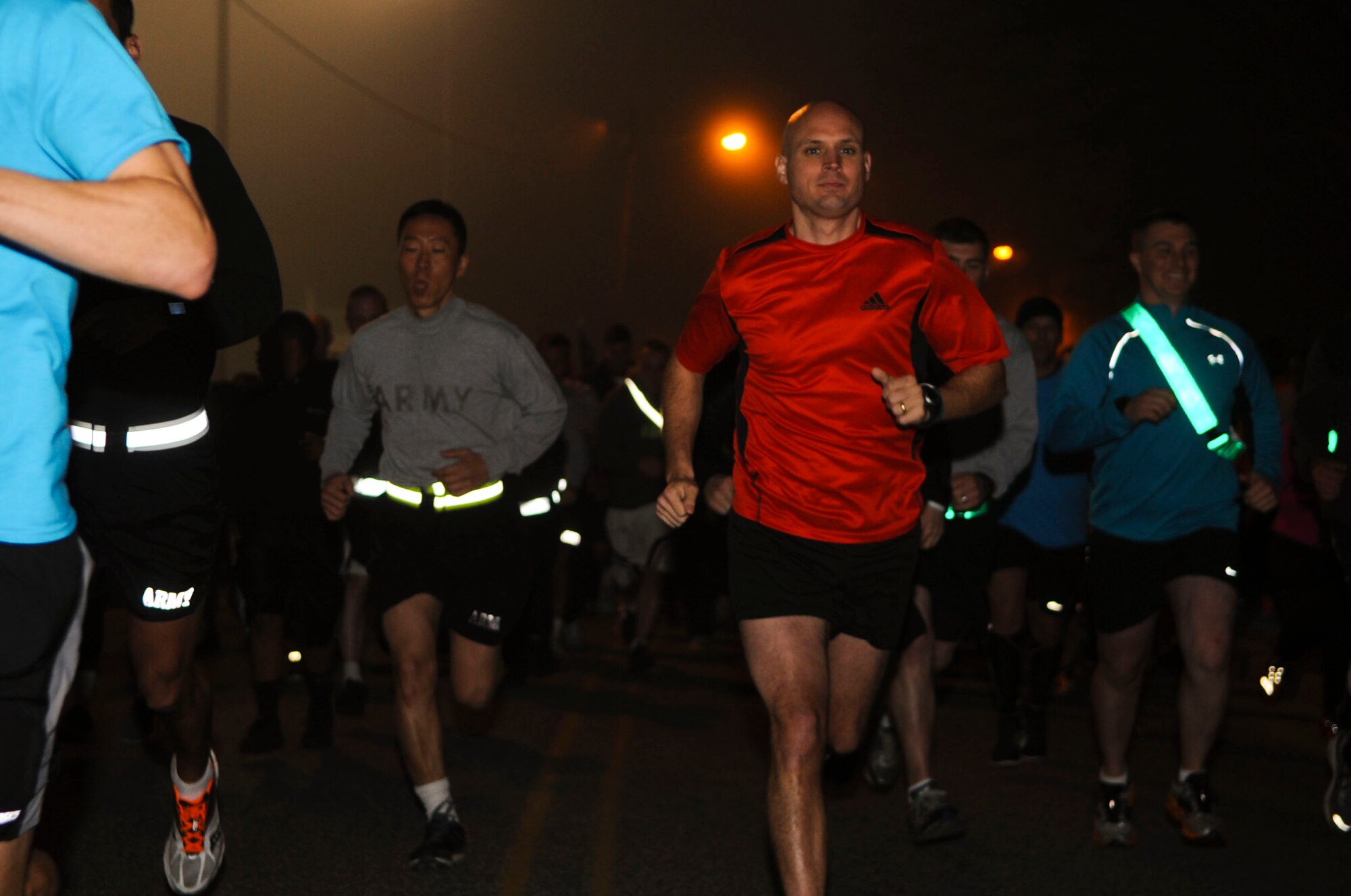 Runners sprint to the finish line during a Sexual Assault Awareness Month 5K run at Fort Eustis, Va., April 4, 2013. More than 500 people attended the event, held to kick off SAAM activities throughout the month. (U.S. Air Force photo by Senior Airman Austin Harvill/Released) 