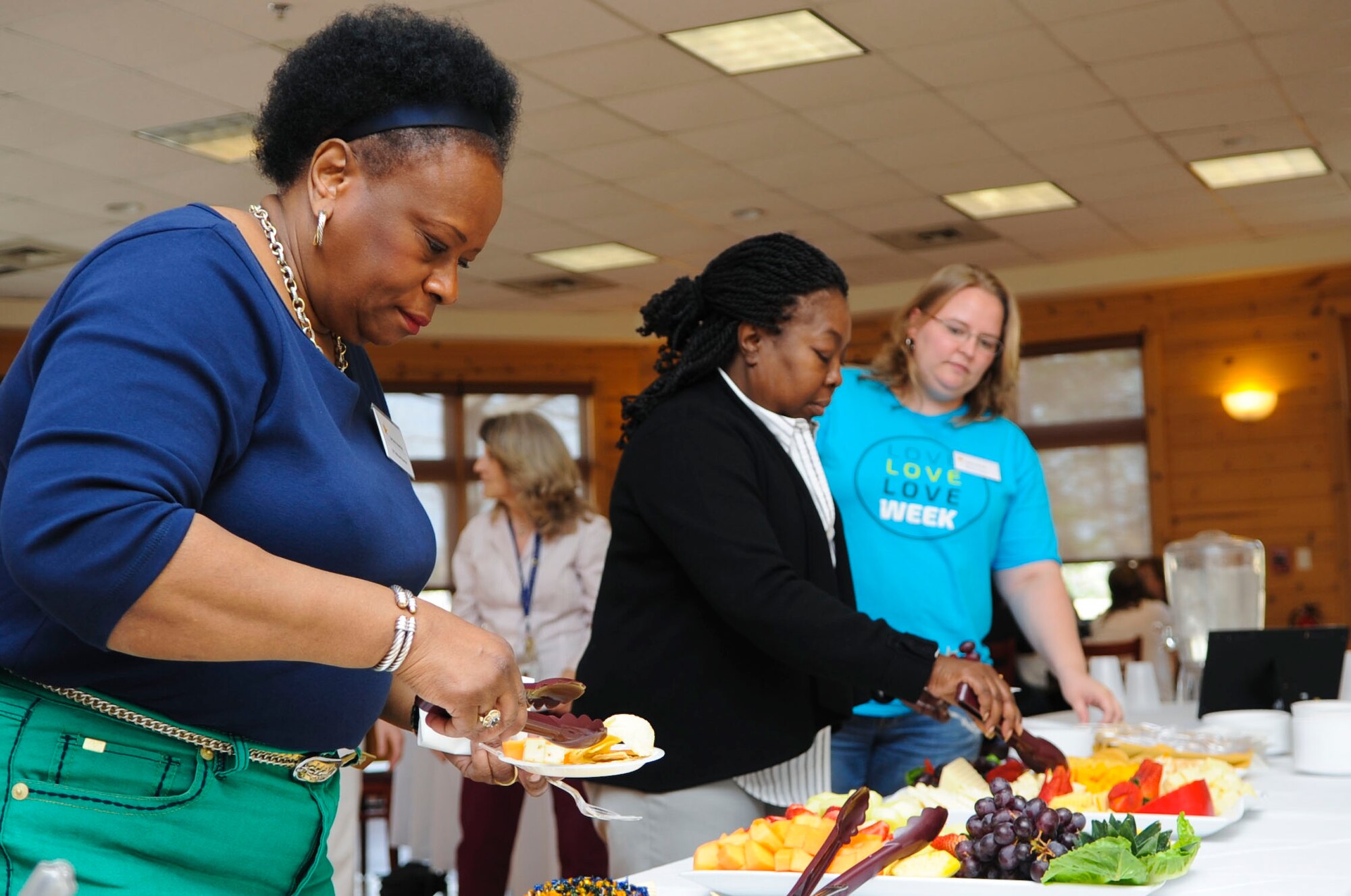 Gold Star family members partake in hor d’oeuvres during a Gold Star Wives Day event at Fort Eustis, Va., April 3, 2014. Each family member who attended the event received a gift basket created by civic groups, such as the Girl Scouts of America. (U.S. Air Force photo by Senior Airman Austin Harvill/Released) 