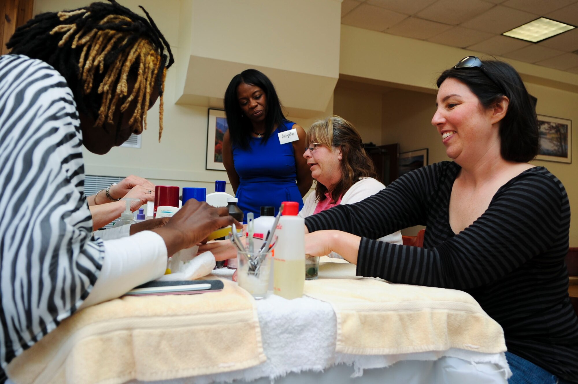 Students from a local beauty school give Gold Star family members free manicures during a Gold Star Wives Day event at Fort Eustis, Va., April 3, 2014. Gold Star families also enjoyed free food, activities, massages and more. (U.S. Air Force photo by Senior Airman Austin Harvill/Released) 