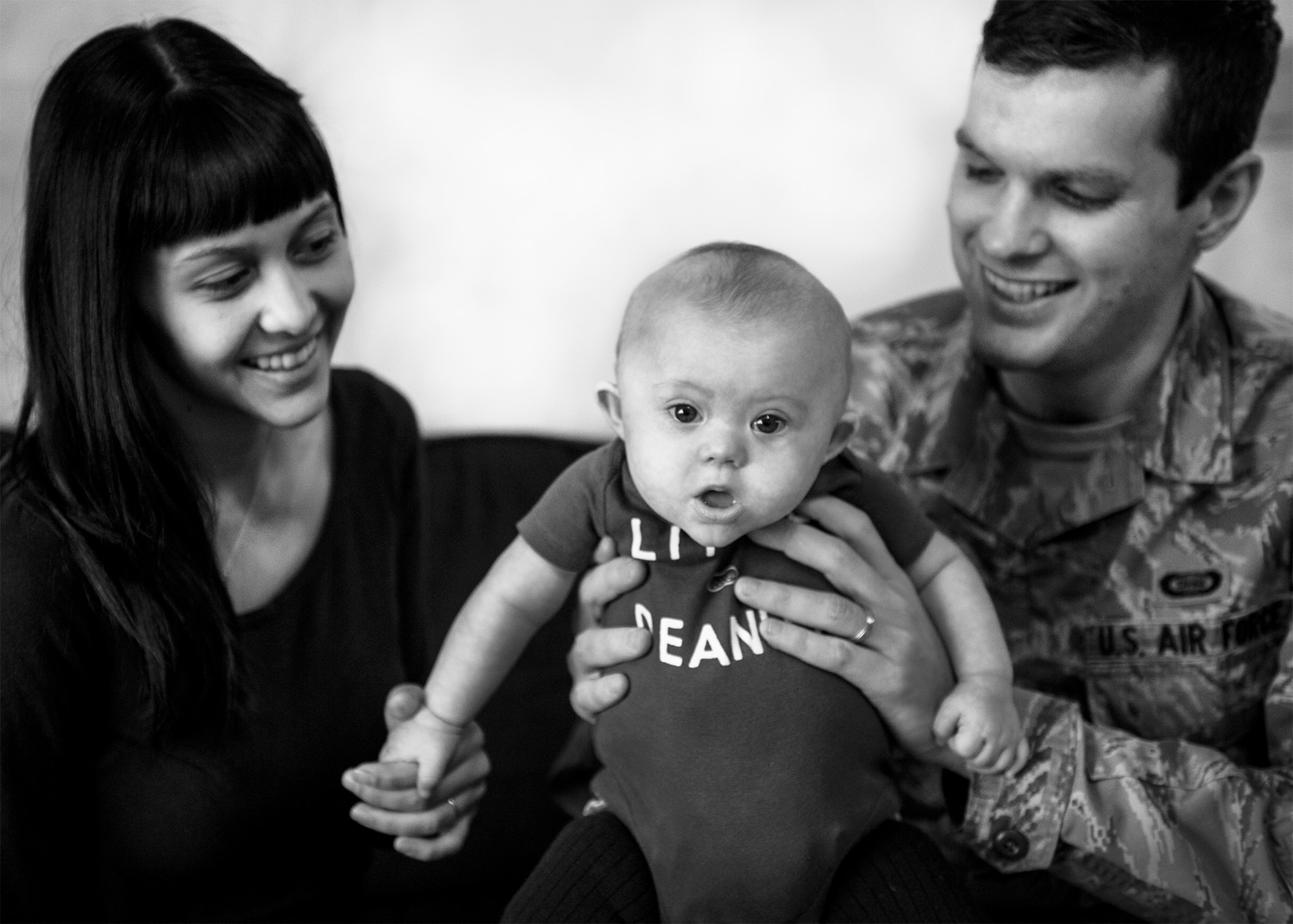 Senior Airman Ian Kennedy, 5th Operations Support Squadron intelligence analyst, and his wife Morgan Kennedy, hold their five-month-old son Sawyer at their home on Minot Air Force Base, N.D. March 14, 2014. Diagnosed with infertility in 2011, the Kennedy’s welcomed their self described miracle child, Sawyer, in October of last year. (U.S. Air Force photos/Airman 1st Class Lauren Pitts)