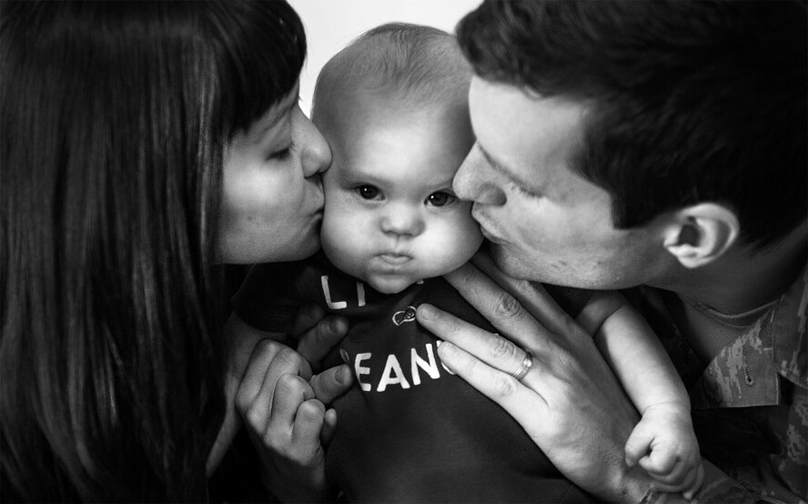 Senior Airman Ian Kennedy, 5th Operations Support Squadron intelligence analyst, and his wife Morgan Kennedy, hold their five-month-old son Sawyer at their home on Minot Air Force Base, N.D. March 14, 2014. Diagnosed with infertility in 2011, the Kennedy’s welcomed their self described miracle child, Sawyer, in October of last year. (U.S. Air Force photos/Airman 1st Class Lauren Pitts)
