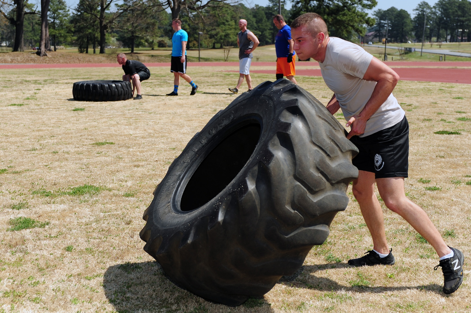 Airman 1st Class Jordan Melendez, 4th Aircraft Maintenance Squadron avionics technician, participates in a combat fitness class, April 2, 2014, at Seymour Johnson Air Force Base, N.C. The new class focuses on improving endurance, stability and confidence. (U.S. Air Force photo by Senior Airman John Nieves Camacho)