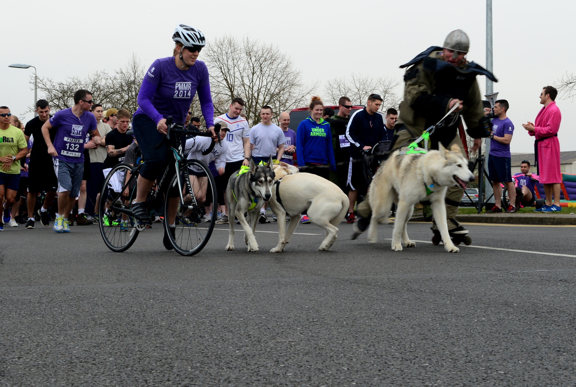 Members of the 48th Fighter Wing and their families prepare to start the 4th Annual Phil Myers Memorial Run at Royal Air Force Lakenheath, England, April 4, 2014. Myers was a member of the 48th Civil Engineer Squadron explosive ordnance disposal flight was killed by an improvised explosive device attack while deployed to Afghanistan in 2009. All donations from the event went to the EOD Memorial Foundation and the Wounded Warrior Project. (U.S. Air Force photo by Airmen 1st Class Dawn M. Weber/Released)