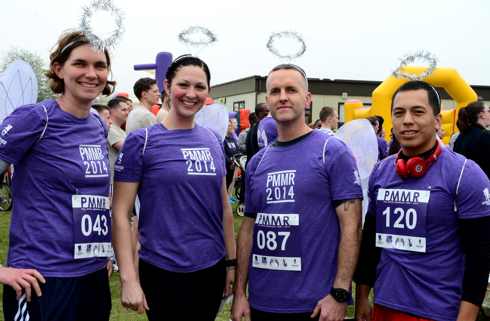 Staff members from the Royal Air Force Lakenheath Chapel dress as angels to run in the 4th Annual Phil Myers Memorial Run, April 4, 2014. Myers, a member of the 48th Civil Engineer Squadron explosive ordnance disposal flight was killed by an improvised explosive device attack while deployed to Afghanistan in 2009. (U.S. Air Force photo by Airman 1st Class Dawn M. Weber/Released)