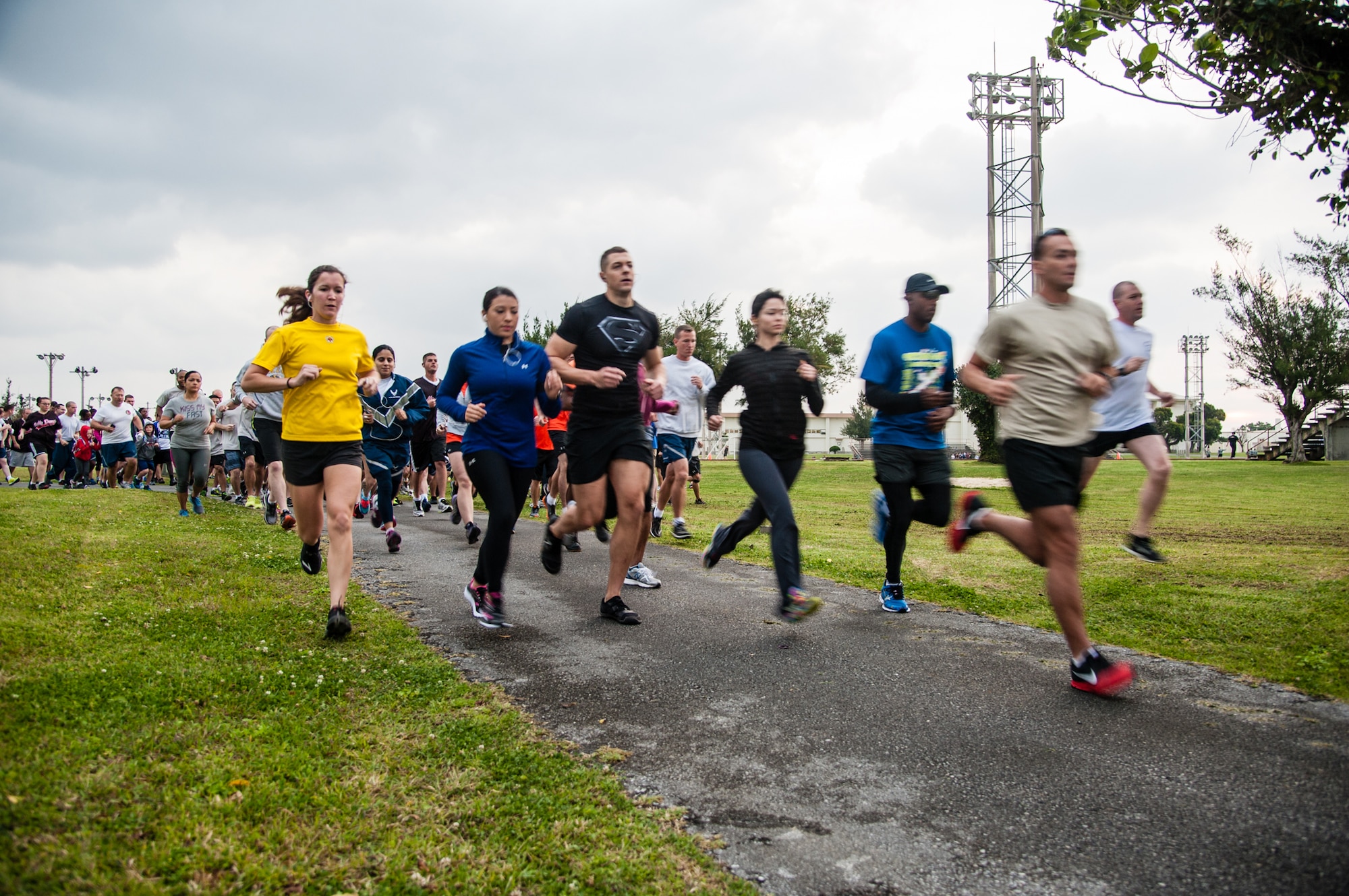 Runners take off for the Habu Trail during the Air Force Assistance Fund 6.5K Habu Run on Kadena Air Base, Japan, April 4, 2014. The route was one mile longer than a typical 5k run to line up with this year's theme, "Go The Extra Mile For An Airman In Need." Money raised during the run is going to the AFAF, which comprises four charities that help Air Force service members and their families with educational needs, aid in emergencies, and a retirement home for widows or widowers of Air Force members in need of financial assistance. (U.S. Air Force photo by Staff Sgt. Alexy Saltekoff)
