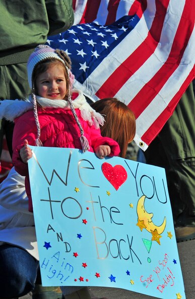 The daughter of a 13th Fighter Squadron pilot awaits the departure of her father at Misawa Air Base, Japan, April 8, 2014. Her father, an F-16 Fighting Falcon pilot, is deploying in support of one of the U.S. Air Force’s many global operations abroad. (U.S. Air Force photo/Senior Airman Jose L. Hernandez-Domitilo)