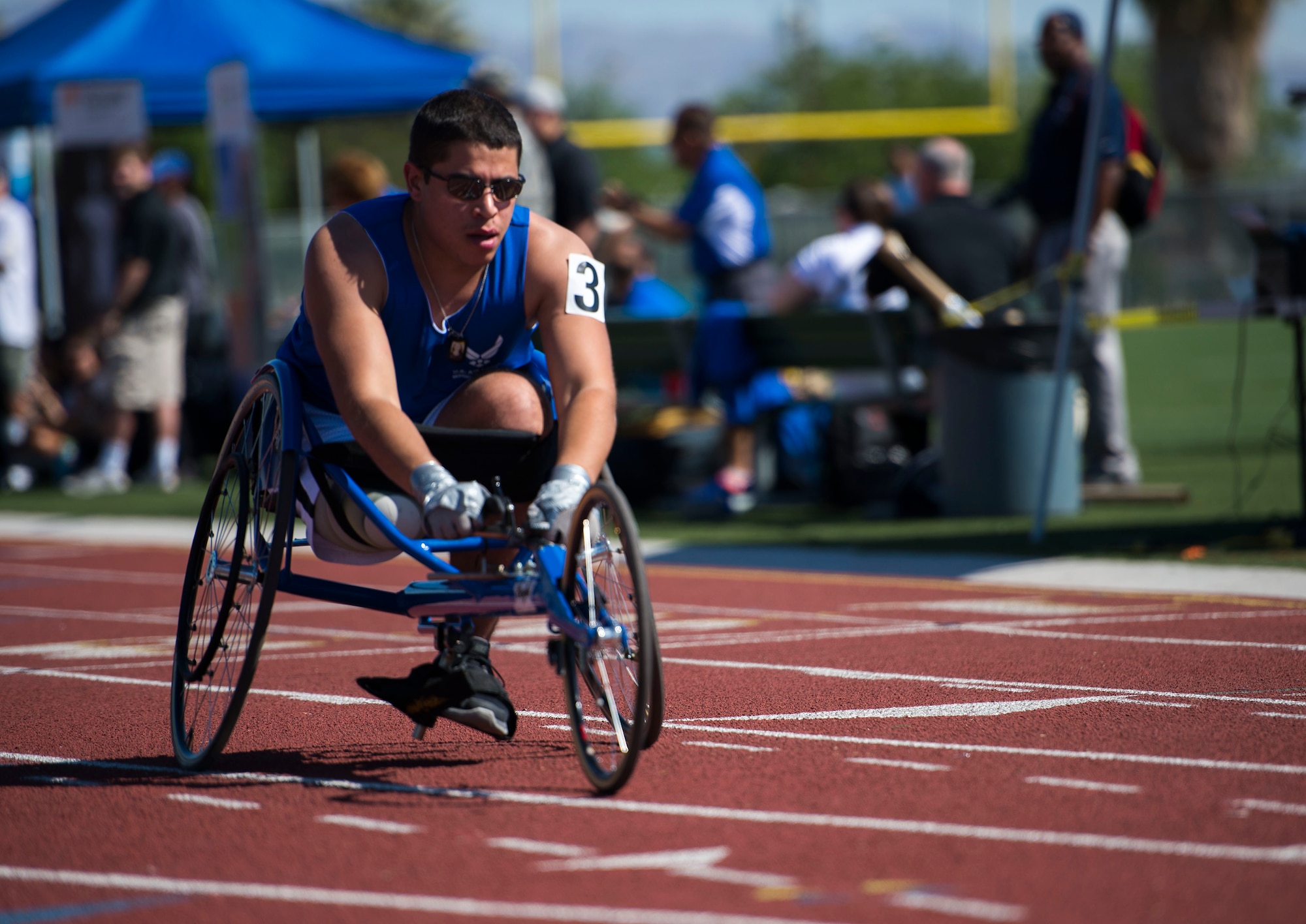 Staff sgt. Mark Johnson raced in a sprinting wheelchair during the track and field portion of the Air Force Trials April 8, 2014, at Rancho High School in Las Vegas, Nev. The Air Force Trials give injured, ill and wounded Airmen a chance to compete in Paralympic-style events.  (U.S. Air Force photo/Senior Airman Jette Carr)