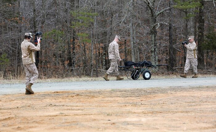 During a Full Systems Test, the Defense Media Activity Marines get the Electric Litter Carrier from all sides. This very early concept is being used to explore the potential benefit of a powered litter. 