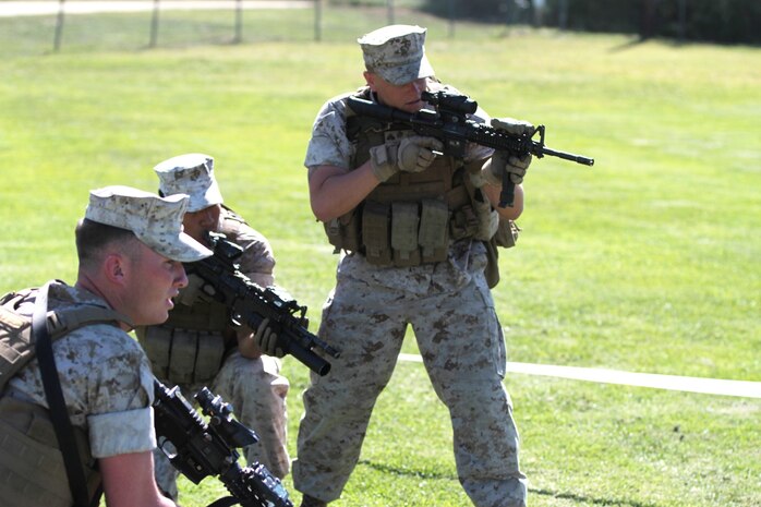 Marines practice urban operation tactics during the Division Schools Urban Leaders Course, aboard Marine Corps Base Camp Pendleton, Calif., April 3, 2014. The Marines are tasked with planning and conducting different methods of urban operations. The course teaches Marines how to effectively shoot, maneuver and communicate in an urban combat environment. (U.S. Marine Corps photo by Lance Cpl. Joshua Murray/released)

