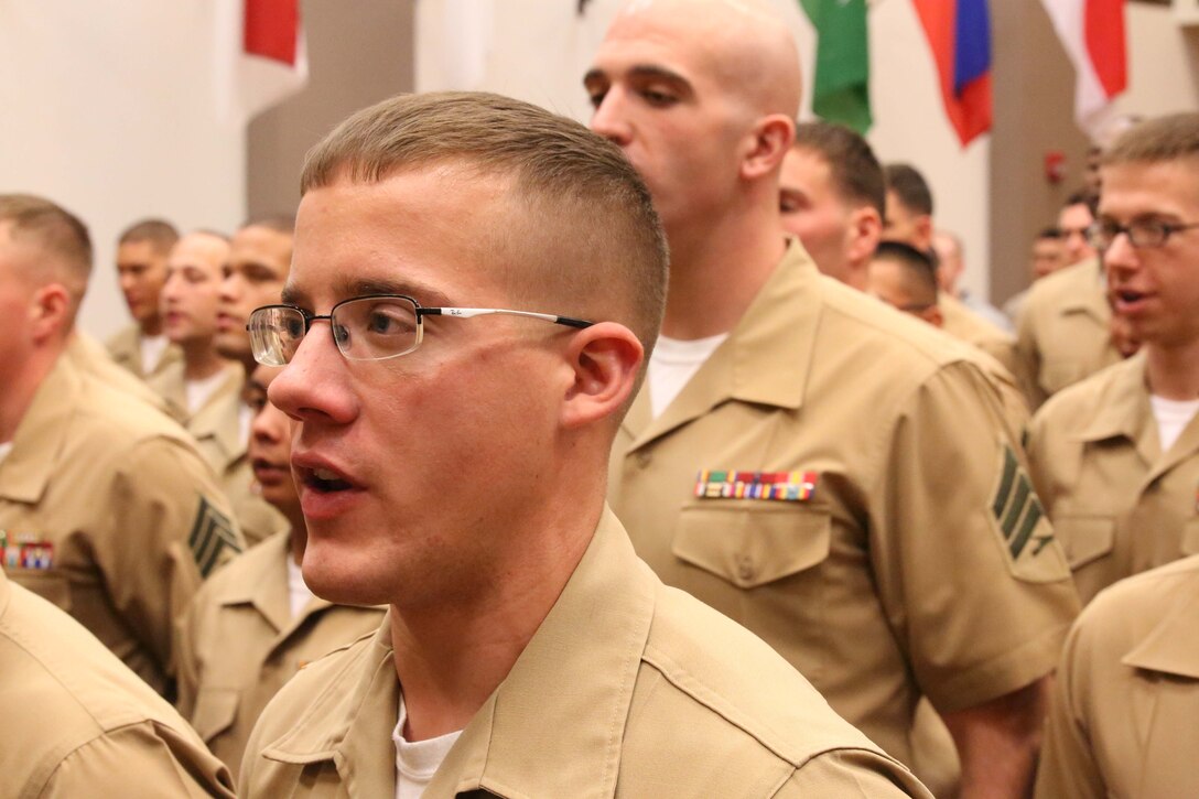 Marine sergeants sing the Marines’ Hymn during a graduation ceremony at Geiger Hall aboard Marine Corps Base Quantico on April 2, 2014. The class was the first to graduate from the condensed four-week Sergeants Course that historically has lasted seven weeks.