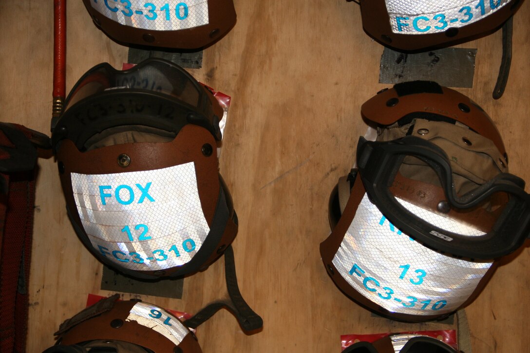Flight mechanic helmets hang on the wall inside Marine Medium Tiltrotor Squadron 261 aboard Camp Bastion, Helmand province, Afghanistan, April 5, 2014. The Marine Corps unit has the responsibility for being the first responders for casualty evacuations throughout the Regional Command (Southwest) area of operations.
