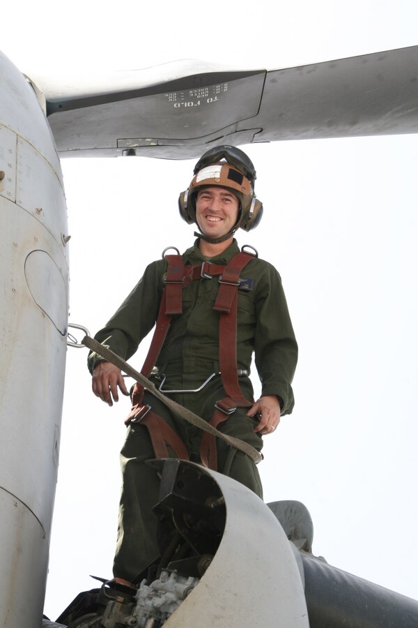 Sergeant Josiah M. Fox, a crew chief with Marine Medium Tiltrotor Squadron 261, pauses for a photo while standing on an MV-22B Osprey aboard Camp Bastion, Helmand province, Afghanistan, April 5, 2014. The Marine Corps unit has the responsibility for being the first responders for casualty evacuations throughout the Regional Command (Southwest) area of operations.

