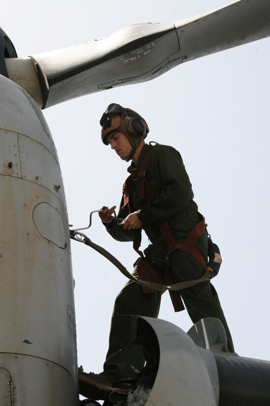 Sergeant Josiah M. Fox, a crew chief with Marine Medium Tiltrotor Squadron 261, tightens bolts on an MV-22B Osprey in order to maintain the aircraft’s readiness aboard Camp Bastion, Helmand province, Afghanistan, April 5, 2014. The Marine Corps unit has the responsibility for being the first responders for casualty evacuations throughout the Regional Command (Southwest) area of operations.
