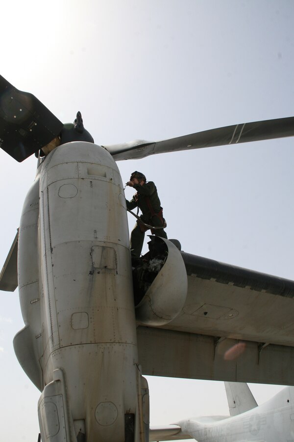 Sergeant Josiah M. Fox, a crew chief with Marine Medium Tiltrotor Squadron 261, works on an MV-22B Osprey in order to maintain the aircraft’s readiness aboard Camp Bastion, Helmand province, Afghanistan, April 5, 2014. The Marine Corps unit has the responsibility for being the first responders for casualty evacuations throughout the Regional Command (Southwest) area of operations.

