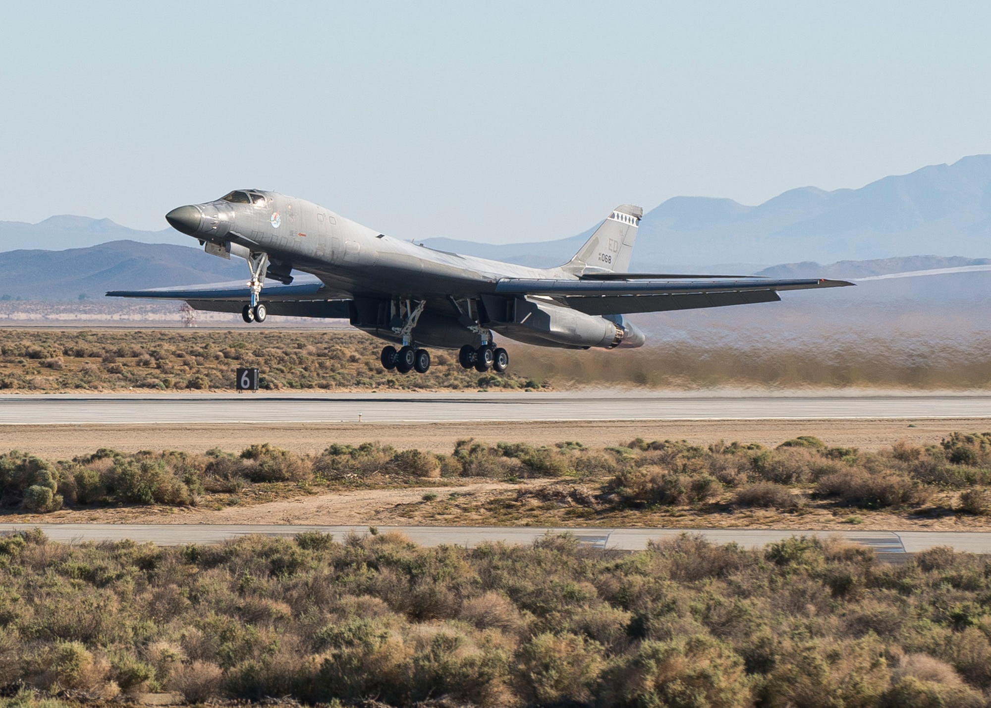 An Edwards B-1B Lancer takes off Runway 22L on April 1 to begin testing its new Sustainment Block 16A (SB 16A) software upgrades. The SB 16A software will work in conjunction with the long-range bomber’s new glass cockpit configuration in order to ensure its capabilities in a fast-paced integrated battlefield of the future. (U.S. Air Force photo by Ethan Wagner)