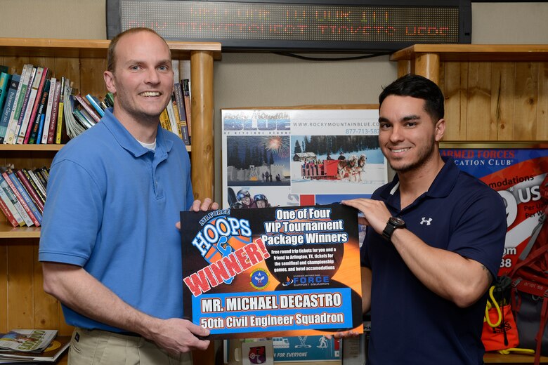 Korey Kuykendall, Schriever Outdoor Recreation and Information, Tickets and Travel manager announced Mike DeCastro, 50th Civil Engineer Squadron, as a VIP Tournament Package Winner April 4.  DeCastro picked up his winning scratch ticket at the Schriever ODR/ITT office during the Air Force Hoops promotion. (U.S. Air Force photo/Chris DeWitt)