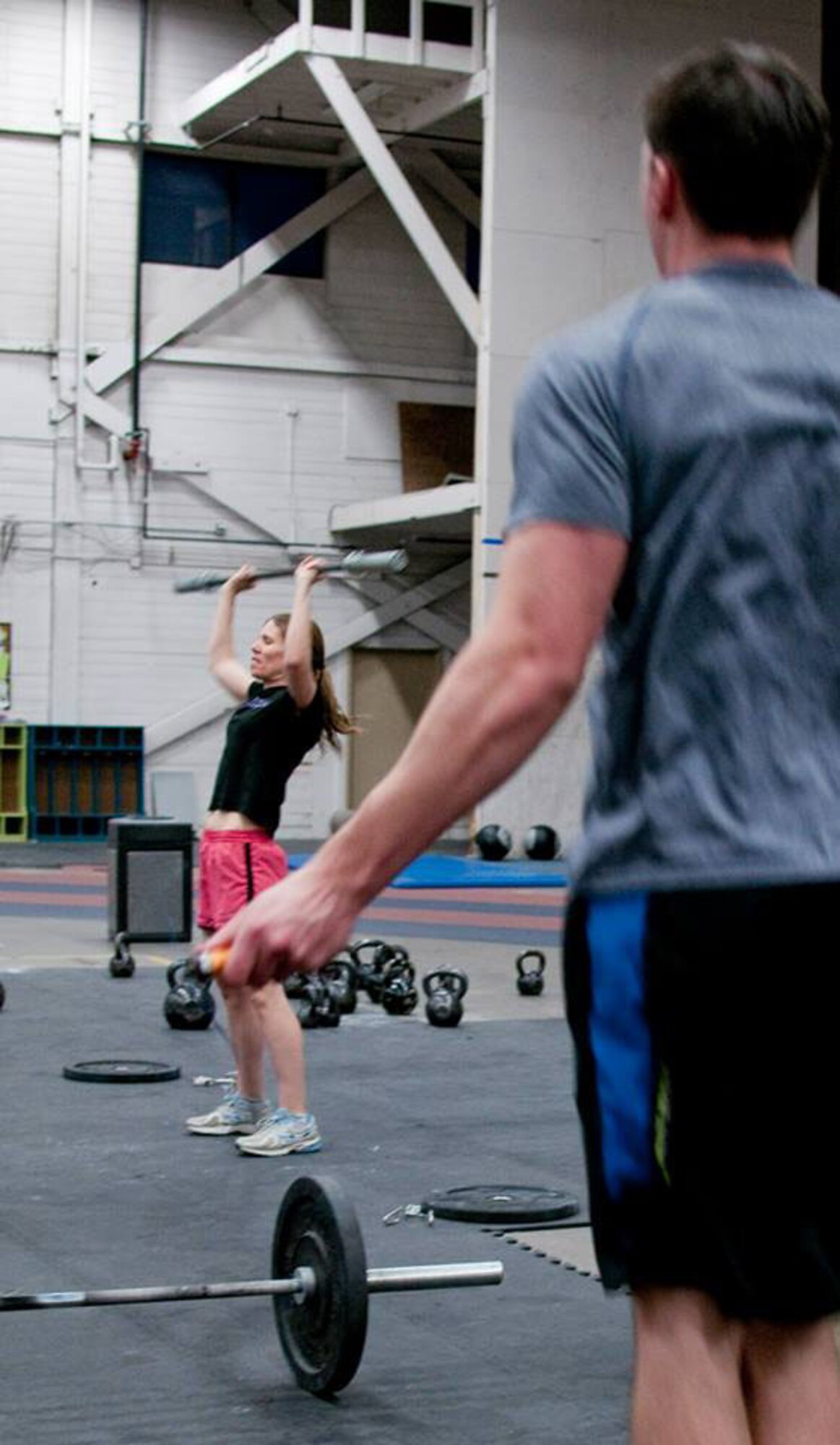 JOINT BASE ELMENDORF-RICHARDSON, Alaska -- Maj. Sharon Ehasz, commander of the 176 Force Support Flight, particiapates in a CrossFit session here March 2 along with other 176 Wing members. The CrossFit class was taught by Tech. Sgt. Christopher Block at 6 a.m. before the drill day. National Guard photo by Tech. Sgt. Jennifer Theulen/ Released