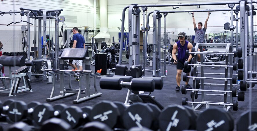 Gym Patrons work out in the weight room at the Commando Fitness center on Hurlburt Field, Fla., April 7, 2014. DoD civilians, Active duty, Guard, and Reserve members can access the fitness center after normal business hours once they sign a statement of understanding.
(U.S. Air Force photo/Staff Sgt. John Bainter)

