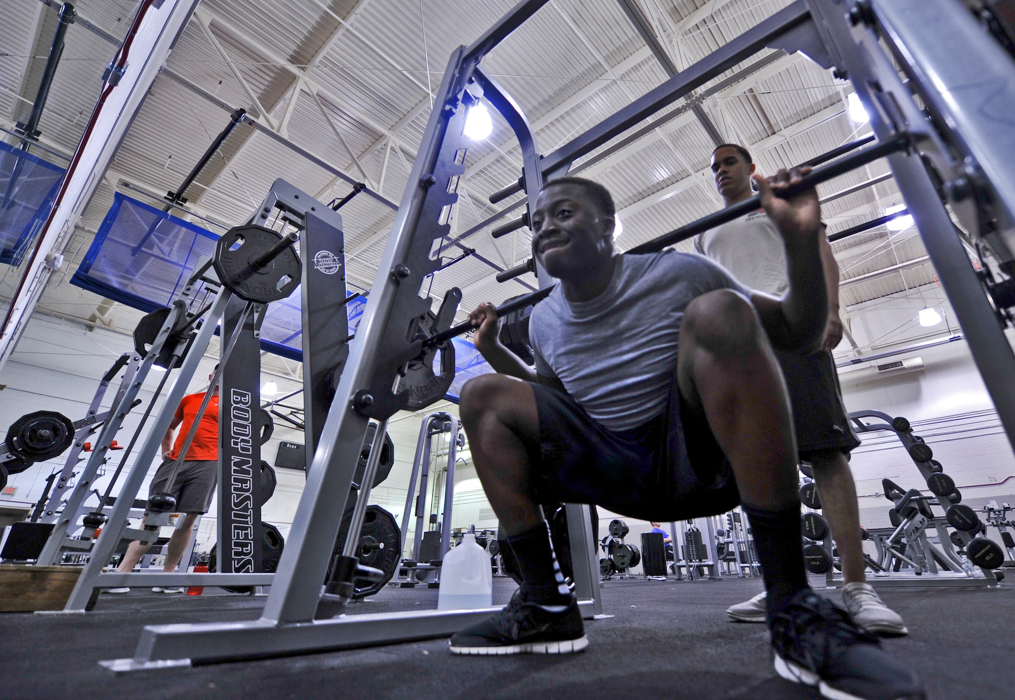 Senior Airman Kadeem Brisbane, 96th Security Forces Squadron response team leader performs a squat at the Commando Fitness Center on Hurlburt Field, Fla., April 7, 2014. Active duty, guard, reserve, and DoD civilian common access cardholders can sign up for the program, which currently has more than 1700 enrolled users.
(U.S. Air Force photo/Staff Sgt. John Bainter)

