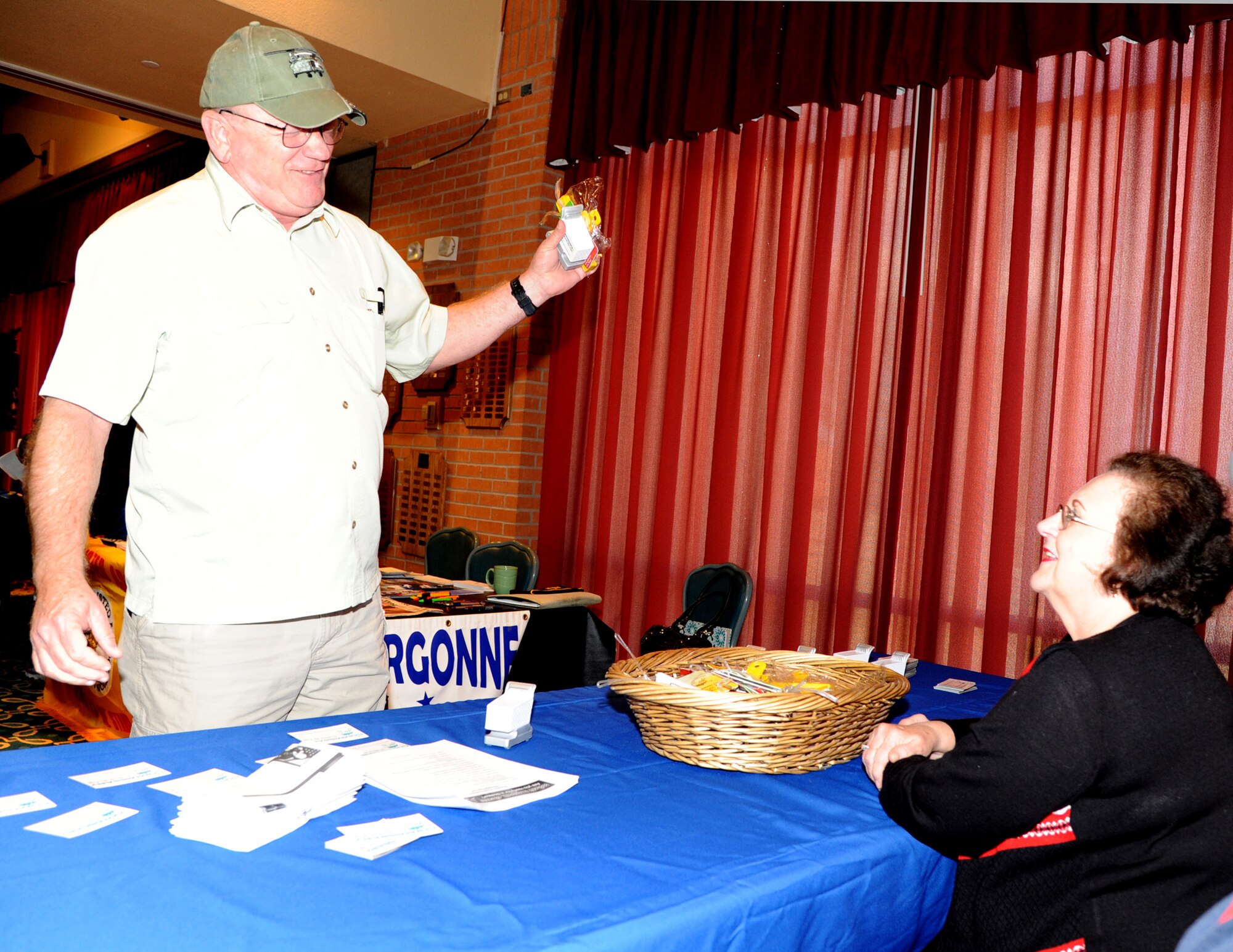 VANCE AIR FORCE BASE, Okla. -- Army 1st Sgt. (Ret.) John Novofny, learns about the benefits shopping at the Commissary could have from Shelia Gilbert, the Commissary director, right, during retiree appreciation night April 8. Nearly every year, military retirees are invited to out to Vance to get an update on what services are available to them.  (U.S. Air Force photo/Senior Airman Frank Casciotta)