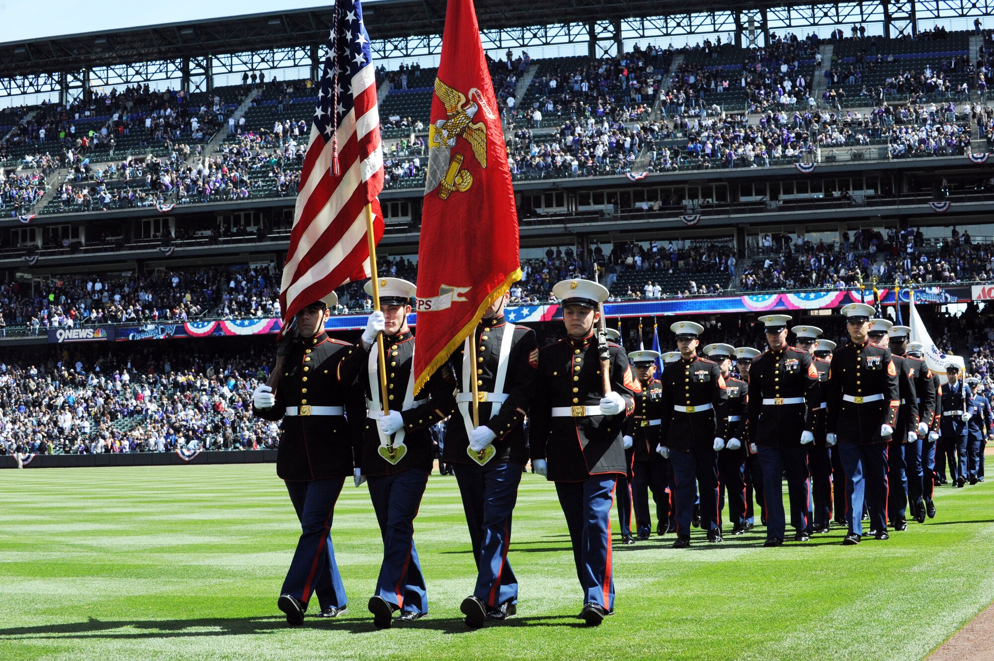 Service members present the colors during the Colorado Rockies Opening Day ceremony April 4, 2014, at Coors Field, Denver. Service members from all U.S. military branches participated in the opening day ceremonies. (U.S. Air Force photo by Airman Emily E. Amyotte/Released)