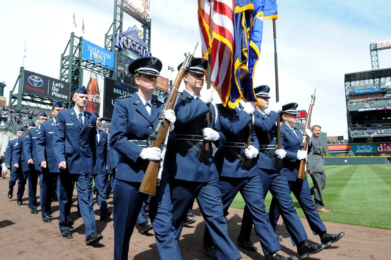 Team Buckley Air Force members march during the Colorado Rockies Opening Day ceremony April 4, 2014, at Coors Field, Denver. Service members from all U.S. military branches participated in the opening day ceremonies. (U.S. Air Force photo by Airman Emily E. Amyotte/Released)