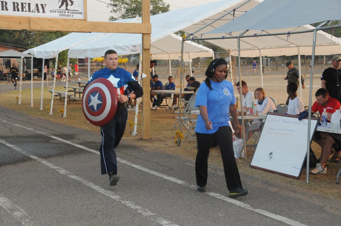 A service member dressed as Captain America participated in the 2nd Annual Wounded Warrior Project 24-Hour Relay. Service members from Joint Task Force-Bravo and the Honduran Air Force Academy participated in the 2nd Annual JTF-Bravo Wounded Warrior Project 24-hour relay April 4-5, 2014 at Soto Cano Air Base, Honduras. Nineteen teams consisting of 4, 6, 8 or 12 members ran or walked almost 2,180 miles to remember their injured brothers and sisters in service and to raise funds for the Wounded Warrior Project. A total of $6,000 has been raised by this event so far with more funds expected to be received. (Photo by U. S. Air National Guard Capt. Steven Stubbs)