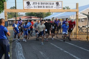 Service members from Joint Task Force-Bravo and the Honduran Air Force Academy participated in the 2nd Annual JTF-Bravo Wounded Warrior Project 24-hour relay April 4-5, 2014 at Soto Cano Air Base, Honduras. Nineteen teams consisting of 4, 6, 8 or 12 members ran or walked almost 2,180 miles to remember their injured brothers and sisters in service and to raise funds for the Wounded Warrior Project. A total of $6,000 has been raised by this event so far with more funds expected to be received. (Photo by U. S. Air National Guard Capt. Steven Stubbs)