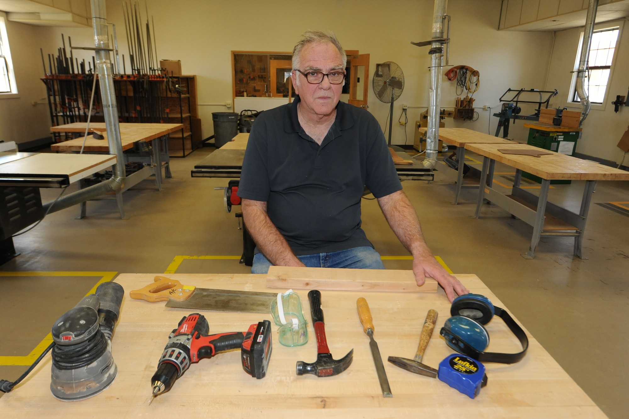 VANCE AIR FORCE BASE, Okla. – Steve Long, the Arts and Crafts Center manager, sits in the reopened woodshop during a soft opening for the Arts and Crafts Center here March 20. Base leadership decided to reopen the Arts and Crafts Center due to several requests from base personnel. The hours are 3 to 7 p.m. Thursdays and Fridays, and 10 a.m. to 6 p.m. Saturdays. (U.S. Air Force photo/Senior Airman Frank Casciotta)