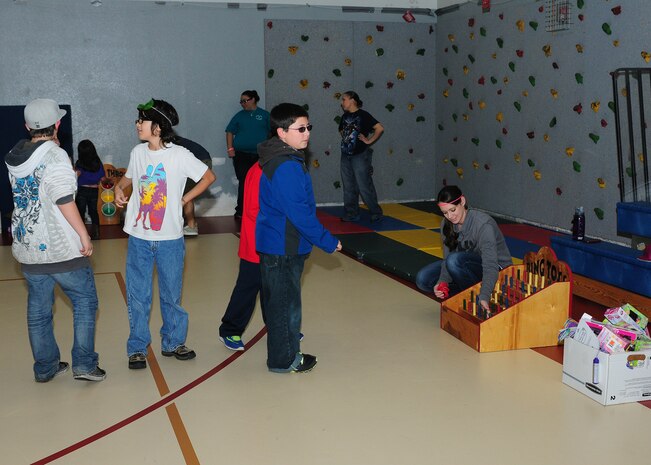 Beale youth participate in a mini game during the Children’s Spring Carnival at the Youth Center on Beale Air Force Base, Calif., April 4, 2014. Children were awarded prizes throughout many of the mini games. (U.S. Air Force photo by Senior Airman Allen Pollard/Released)