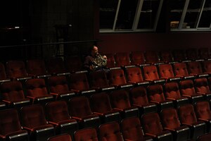 Senior Master Sgt. Kent Wyatt practices before The U.S. Air Force Band takes the stage at Monroe Community College in Monroe, Mich., April 8, 2014. Wyatt, a native of Arlington, Texas, is a french hornist with the Concert Band, the largest ensemble of the Band. The bandsmen are midway through their 2014 spring tour featuring the Concert Band and Singing Sergeants, the official chorus of the U.S. Air Force. (U.S. Air Force photo/Master Sgt. Tammie Moore)