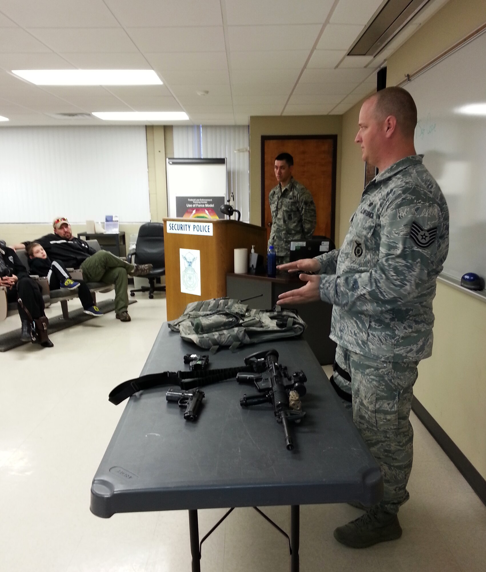 Tech Sgt. Joseph Cope of the 188th Security Forces Squadron briefs Believers Home School Group on the equipment the Flying Razorback Defenders use during a tour of the 188th Fighter Wing April 9, 2014. Approximately 115 members of the group also toured the 188th’s Fire Emergency Services Flight and A-10 static display. The group also received a mission briefing on the 188th’s on-going conversion from fighters to an Intelligence, Reconnaissance and Surveillance, space-focused targeting and remotely piloted aircraft mission.  (U.S. Air National Guard photo by Maj. Heath Allen/Released)